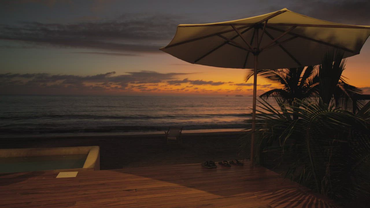 Sunset over the sea seen from a beachfront terrace